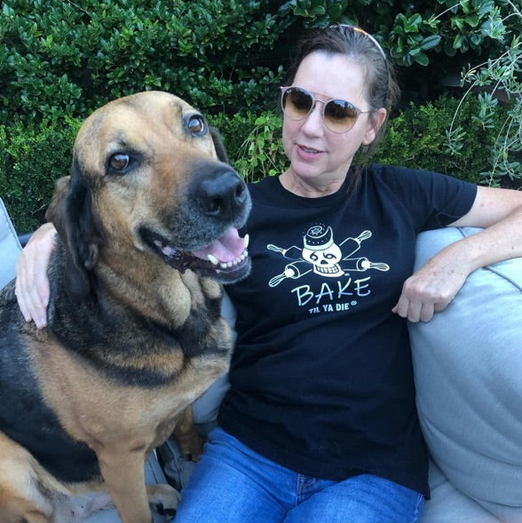 Bake in Bake Til Ya Die short sleeve black t-shirt with her happy dog.