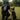 Man in K9Unit uniform with a dog on a grassy field Wearing the Honor Til Ya Die K9 t-shirt in black by Nola Til Ya Die